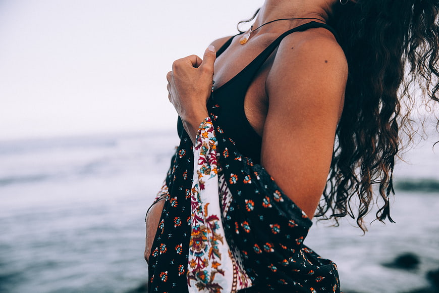 Woman in Floral Coverup by the Ocean
