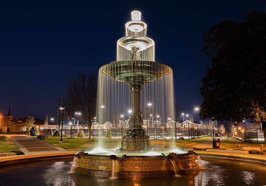 Illuminated Tiered Fountain at Night in Park