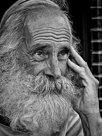 Black and white portrait of elderly man with long beard