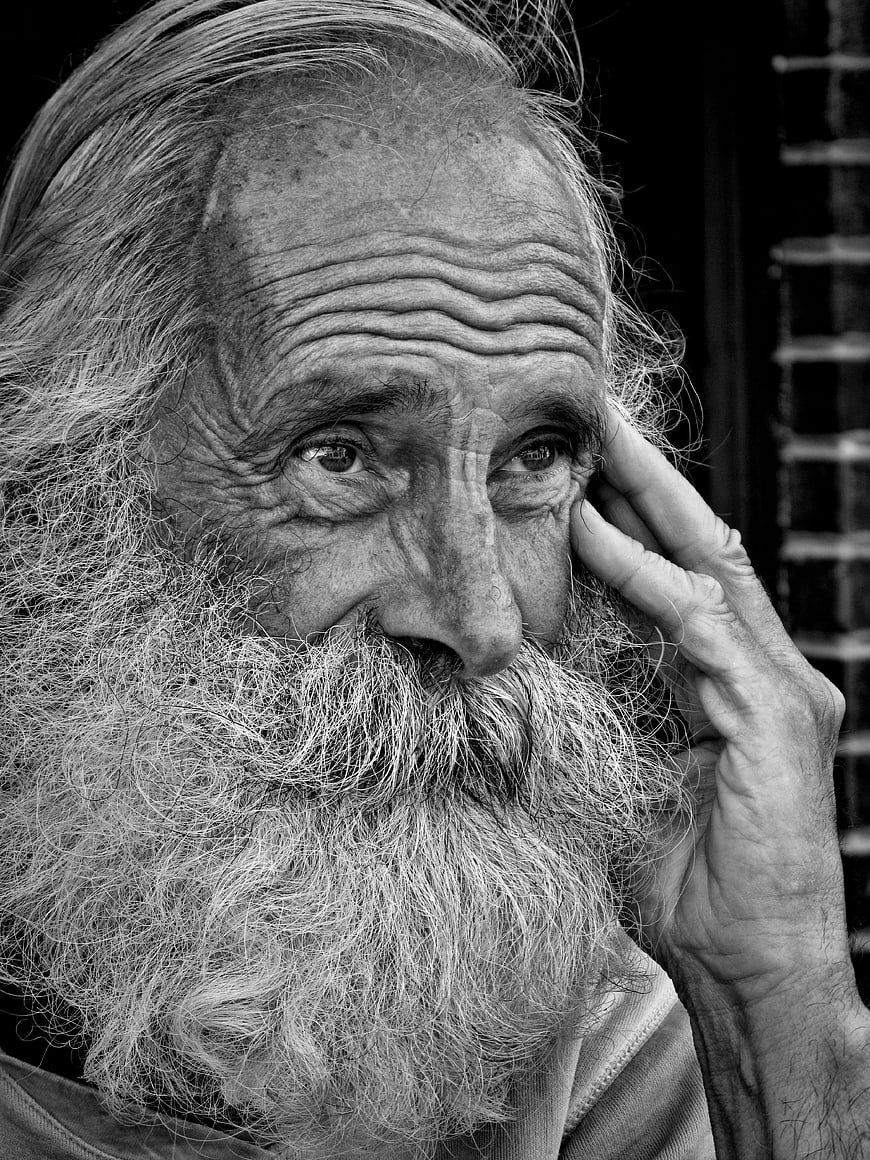 Black and white portrait of elderly man with long beard
