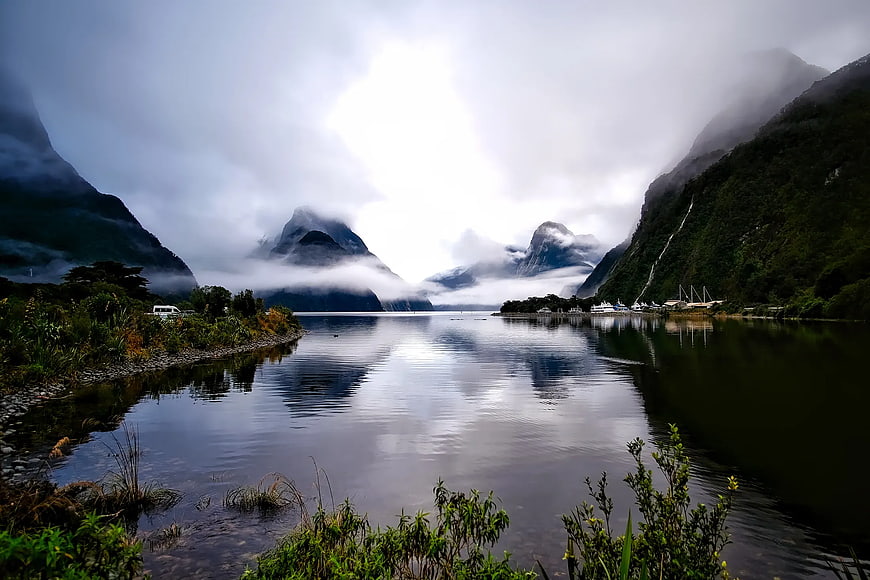 Misty Mountains and Calm Fjord Water Landscape