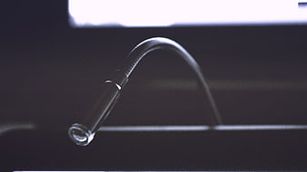 Close-up of a flexible gooseneck microphone on a dark background