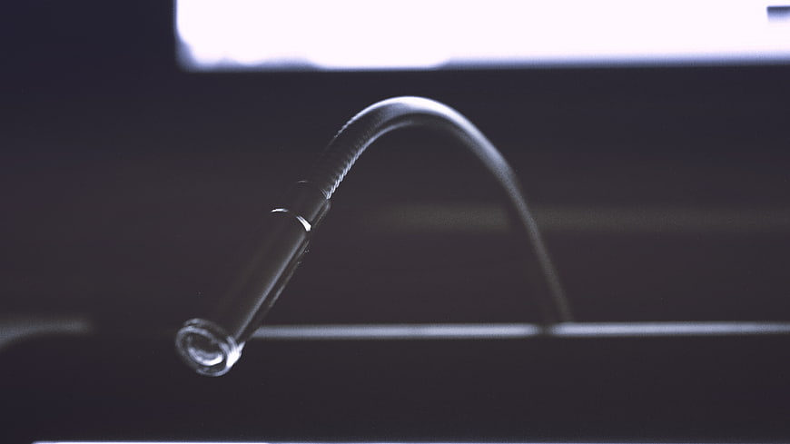 Close-up of a flexible gooseneck microphone on a dark background
