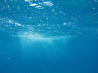 Underwater Ocean Surface View With Sunlight Rays And Bubbles