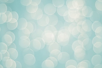 Abstract Light Blue Bokeh Background with Soft White Circles