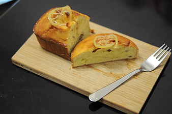 Homemade Lemon Loaf Cake Sliced on Wooden Board