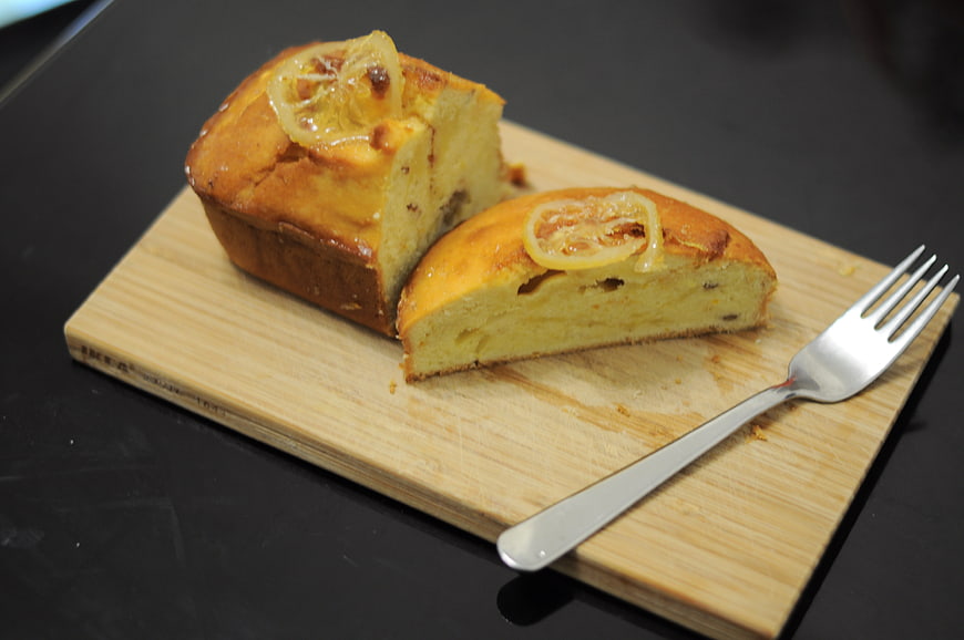 Homemade Lemon Loaf Cake Sliced on Wooden Board