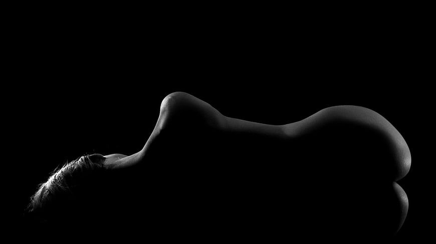 Black and white silhouette of a woman's body profile