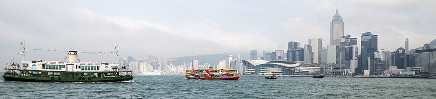 Panoramic View of Hong Kong Skyline and Victoria Harbour Ferries