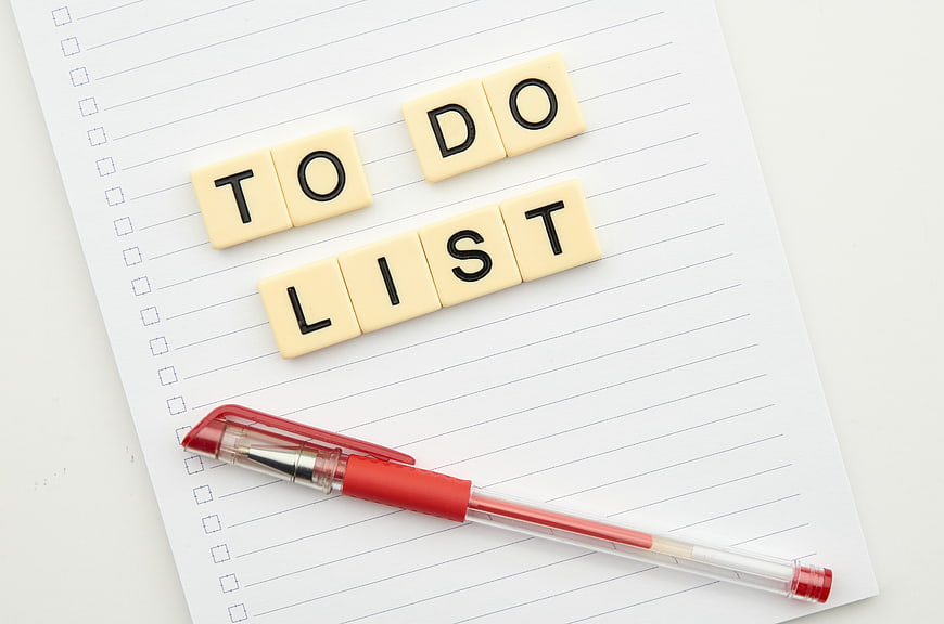 To Do List Scrabble Tiles on Notepad with Red Pen