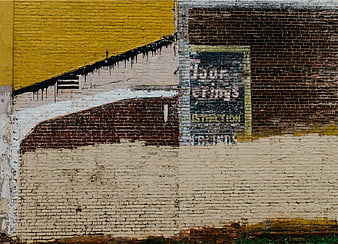 Colorful Graffiti Art on Weathered Brick Wall