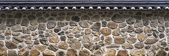 Traditional Stone Wall Texture With Dark Roof Tiles
