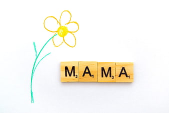 Mama Scrabble Tiles With Crayon Flower Drawing On White Background