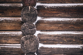 Snowy wooden log cabin wall texture background