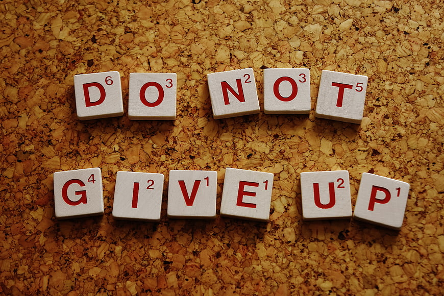 Do Not Give Up Scrabble Tiles on Cork Board