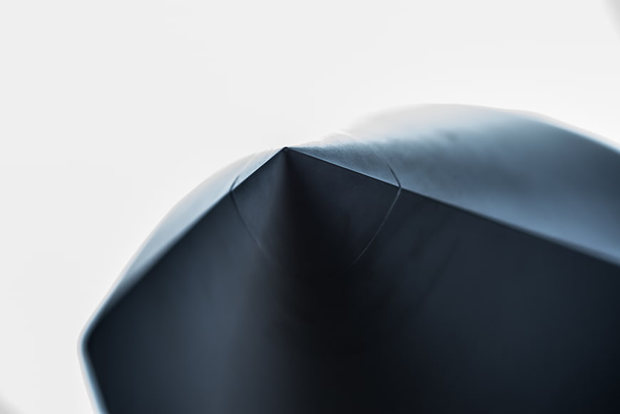 Abstract Close-Up of Dark Geometric Aircraft Nose Cone
