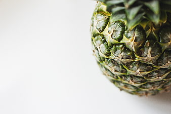 Close-up of green pineapple on white background