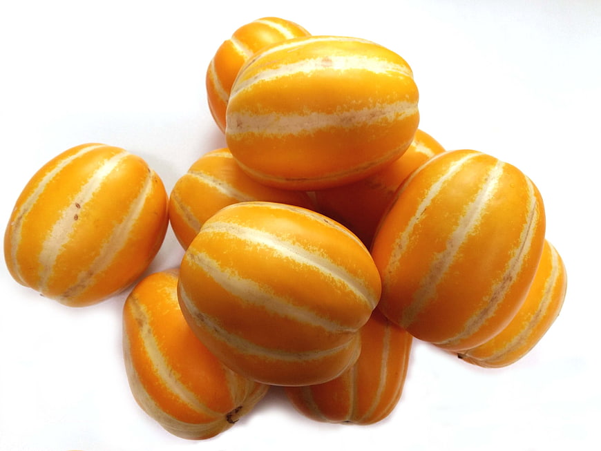 Cluster of Yellow Striped Melons on White Background
