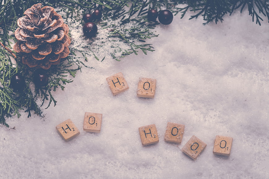 Christmas Scrabble Tiles Spelling Ho Ho Ho in Snow