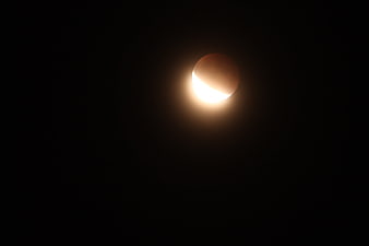 Partial Lunar Eclipse Against Dark Night Sky