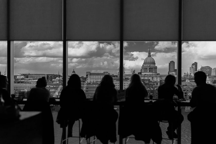 Silhouettes of People Looking at London Skyline