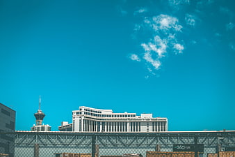 Modern city skyline with blue sky and clouds
