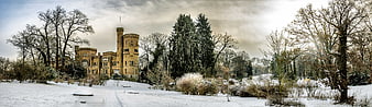 Panoramic view of Babelsberg Palace in snowy winter landscape