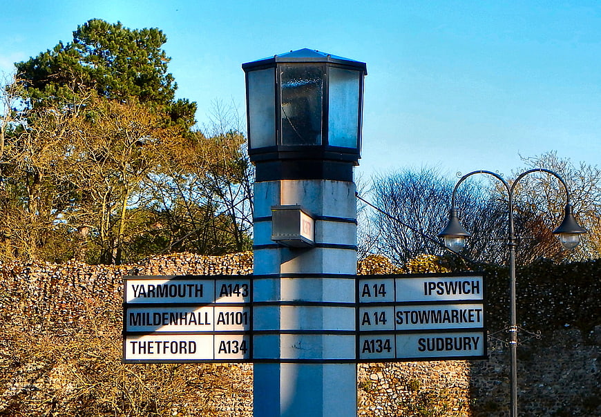 Traditional English Directional Signpost With Road Names And Distances