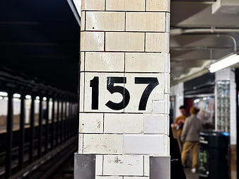 Close-up of Number 157 on NYC Subway Platform Pillar