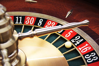 Close-up of a Roulette Wheel with Ball on Number 24