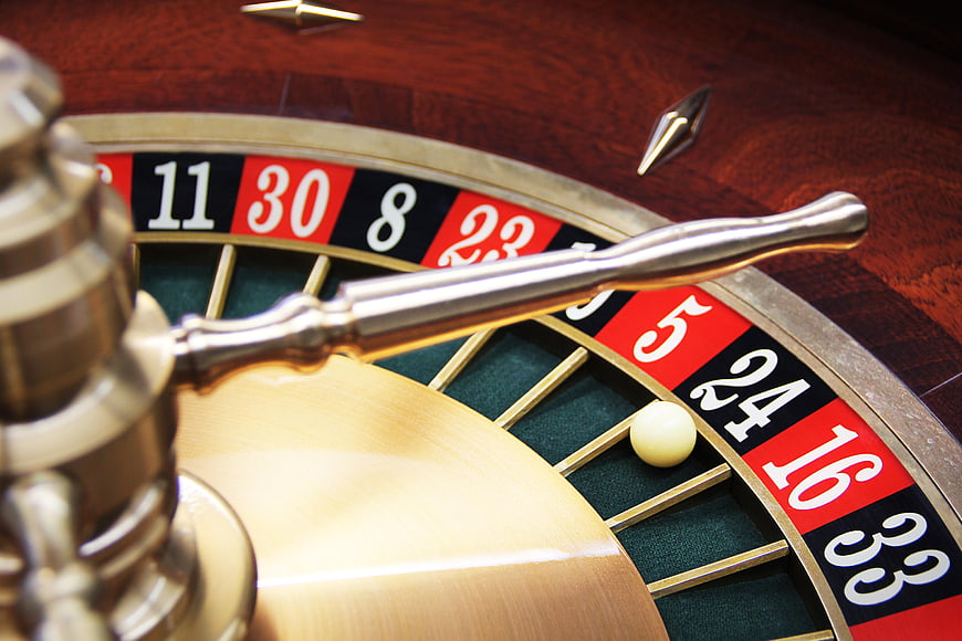 Close-up of a Roulette Wheel with Ball on Number 24