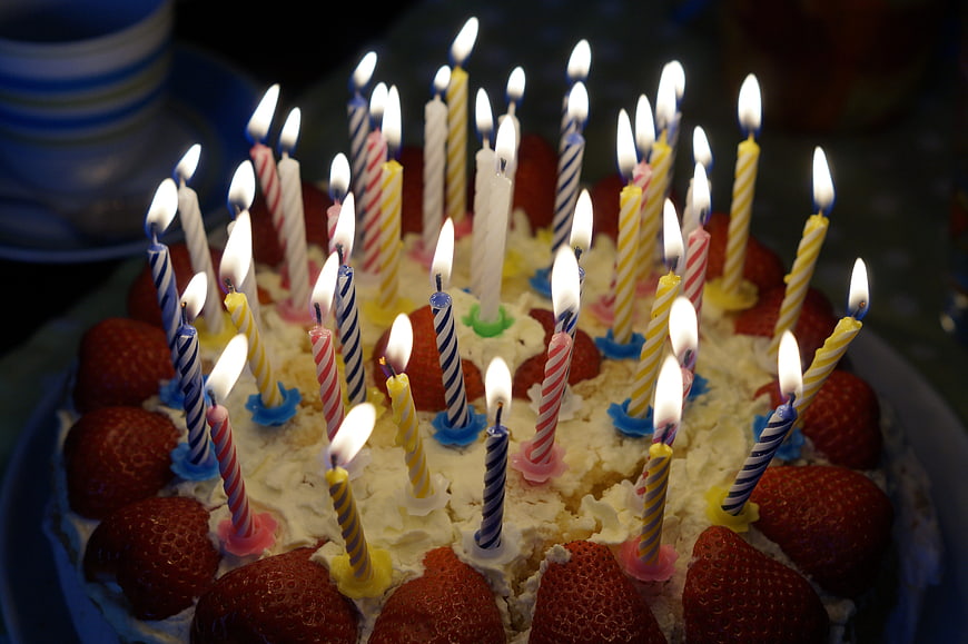 Strawberry Birthday Cake with Lit Candles