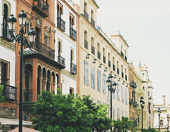 Colorful historic buildings and balconies in Seville, Spain