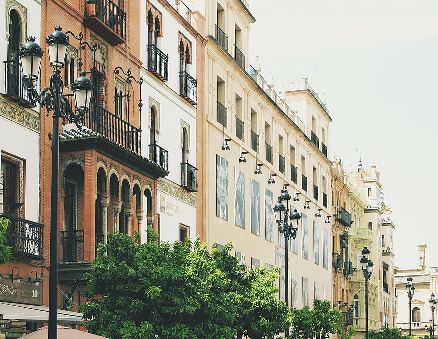 Colorful historic buildings and balconies in Seville, Spain