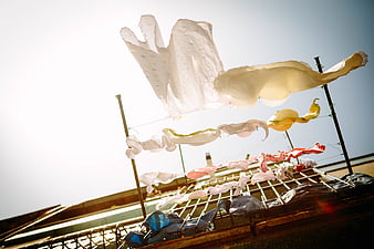 Laundry Drying on Rooftop Clothesline in Sunlight