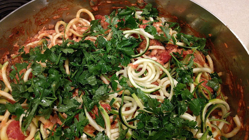 Zucchini Noodles With Fresh Parsley And Tomato Sauce In Metal Pan