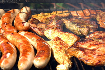 Assorted Grilled Sausages and Marinated Meat on a Barbecue Grill