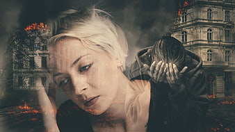 Double exposure portrait of woman with burning city and despair