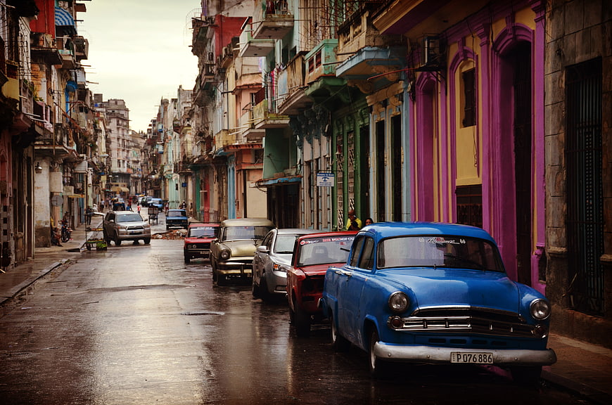 Vintage Blue Car on Wet Street in Havana Cuba