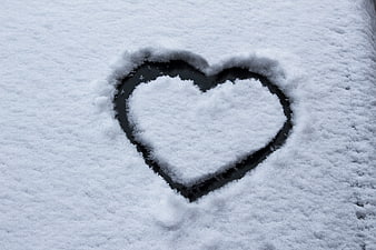 Heart Shape Drawn In Fresh Snow On Car Surface