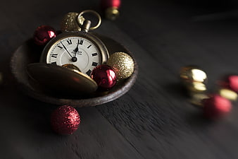Vintage Pocket Watch with Christmas Ornaments on Dark Wood