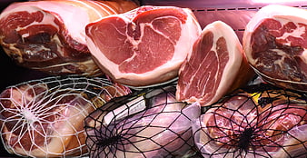 Fresh and Smoked Ham Display in Butcher Shop