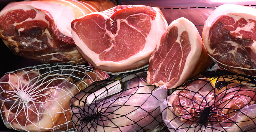 Fresh and Smoked Ham Display in Butcher Shop