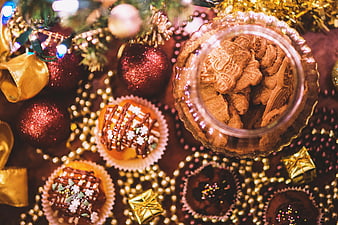 Overhead view of Christmas cookies and festive holiday decorations