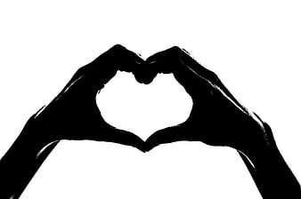 Black Silhouette of Hands Forming Heart Shape on White Background
