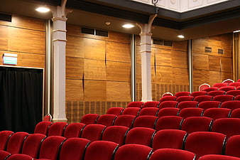 Empty Red Theater Seats in Wooden Auditorium