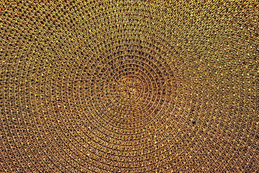 Golden spiral metal mesh texture background