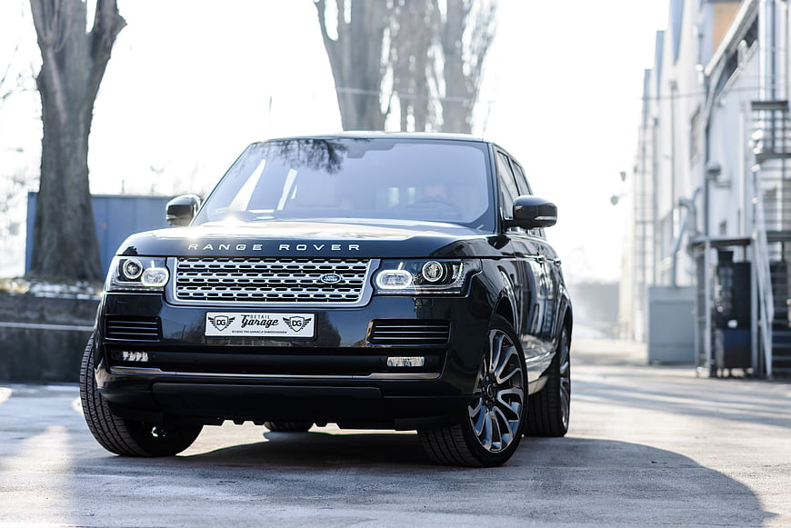 Black Range Rover SUV Front View On Urban Street