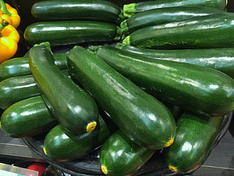 Fresh Green Zucchini Displayed On Store Shelf