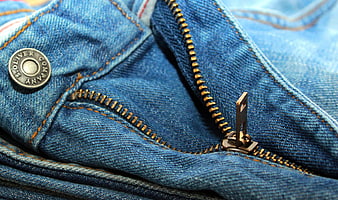 Close-up of Blue Denim Jeans Zipper and Button Detail